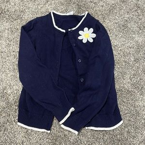 blue kids crewneck button up sweater with daisy